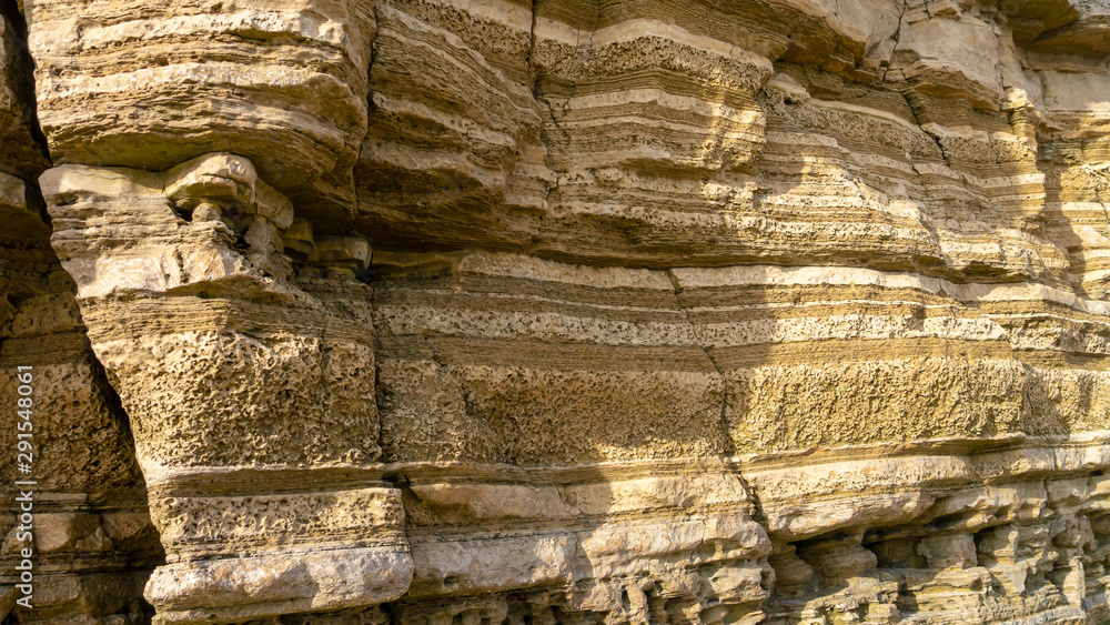 Rock face close up photo from Marsden Bay in South Shields, Tyne and Wear, England UK. Image showing multi-layered limestone rock structure. Rock face close up photo from Marsden Bay in South Shields, Tyne and Wear, England UK. Image showing multi-layered limestone rock structure.