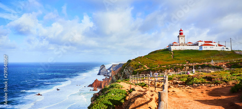 Cabo da Roca, Portugal. Lighthouse and cliffs over Atlantic Ocean, the most westerly point of the European mainland. photo