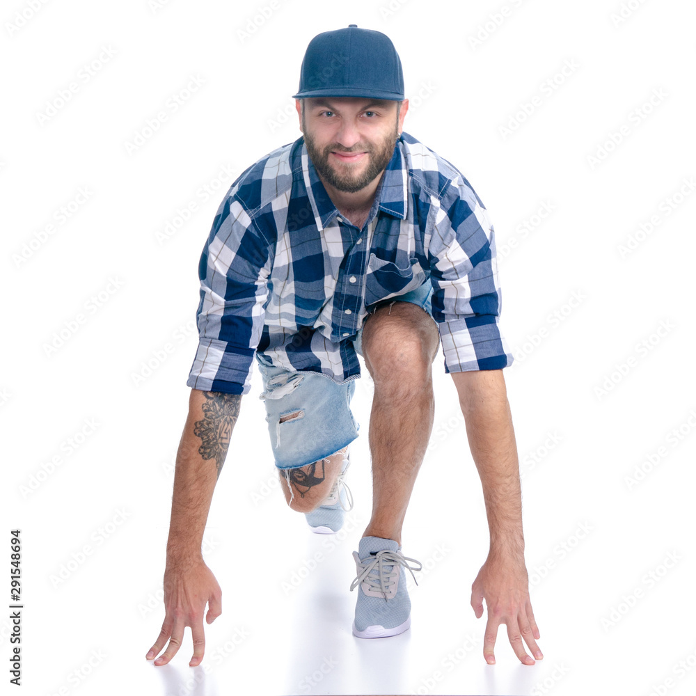 Man in jeans shorts, cap, casual clothing running smiling on white background isolation Man in jeans shorts, cap, casual clothing running smiling on white background isolation