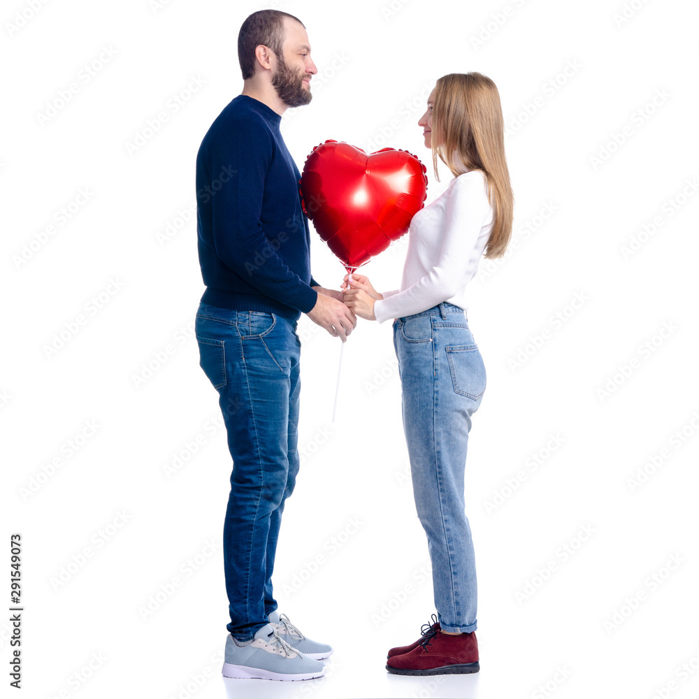 Beautiful romantic couple woman and man with red balloon shape heart on white background isolation Happy Saint Valentine's Day Beautiful romantic couple woman and man with red balloon shape heart on white background isolation Happy Saint Valentine's Day