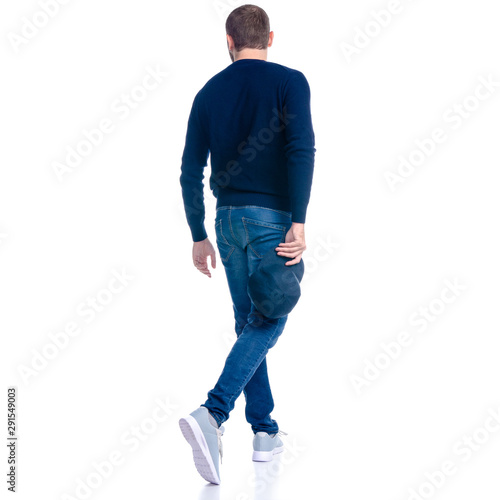 Man in jeans shorts, cap, casual clothing walking goes looking on white background isolation, rear view