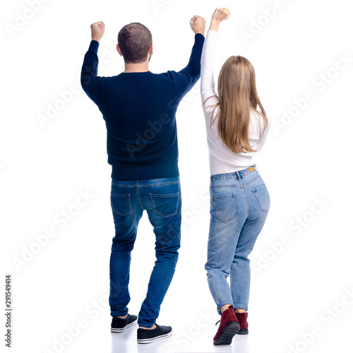 Young couple woman and man happiness winner win looking on white background isolation, rear view