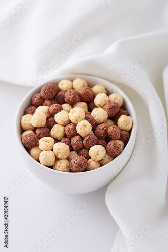 Breakfast cereals in a bowl viewed from above. Top view