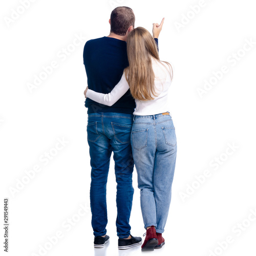 Young couple woman and man showing pointing looking on white background isolation, rear view