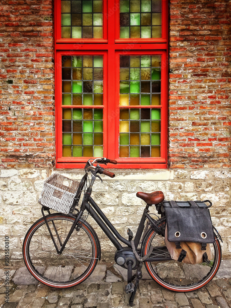 bicycle in front of old house