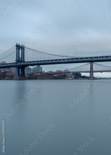 Brooklyn and Manhattan Bridges from East river on a cloudy morning with long exposure © Andriy Stefanyshyn