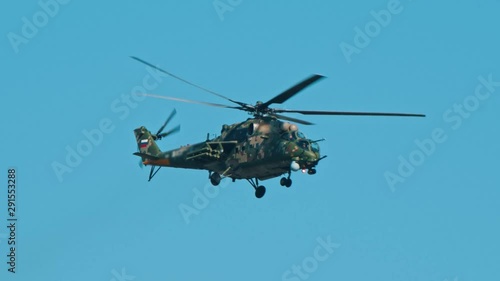 Wallpaper Mural An army green camouflage coloring helicopter flying in the clear sky Torontodigital.ca