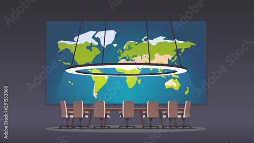 Boardroom with world map on big projection screen
