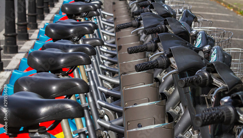 Canvas Print Dublin city bike bicycle rental hire, row of bikes in stand at hire station