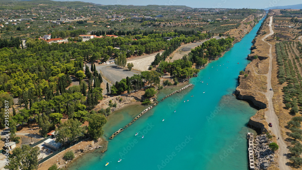 Aerial bird's eye view photo taken by drone of stand up paddle surfers in annual SUP crossing competition in Corinth Canal, Greece