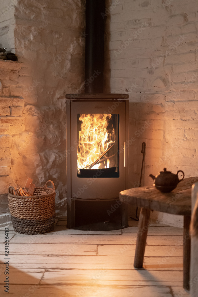 Wood stove fireplace in comfort cozy house Stock Photo | Adobe Stock