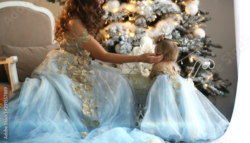 mom and baby at Christmas in beautiful outfits photo