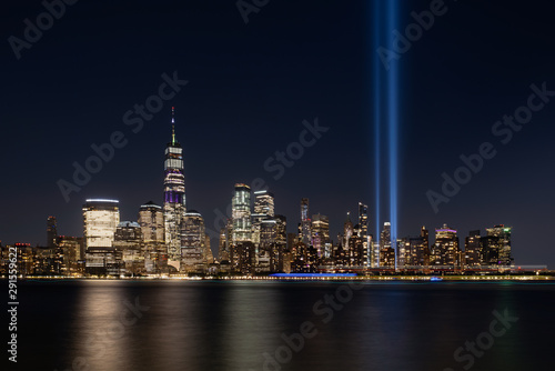 Jersey City, NJ - USA - Aug 30 2019: The 9/11 Tribute in Lights temporary monument in lower Manhattan New York City view from New Jersey