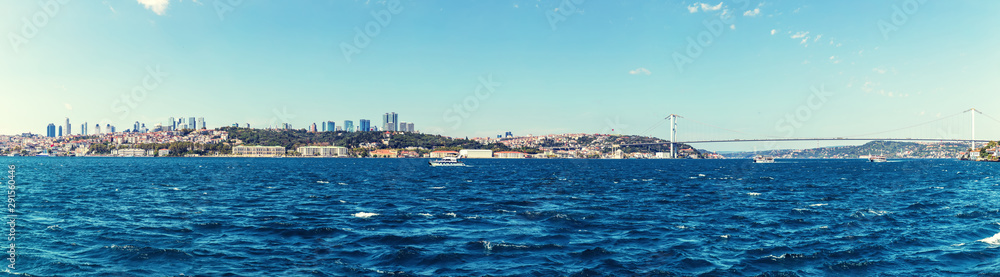 Istanbul sea panorama, business district and Ortakoy Mosque on the background