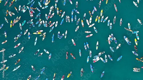 Aerial bird's eye view photo taken by drone of stand up paddle surfers in annual SUP crossing competition in Corinth Canal, Greece © aerial-drone