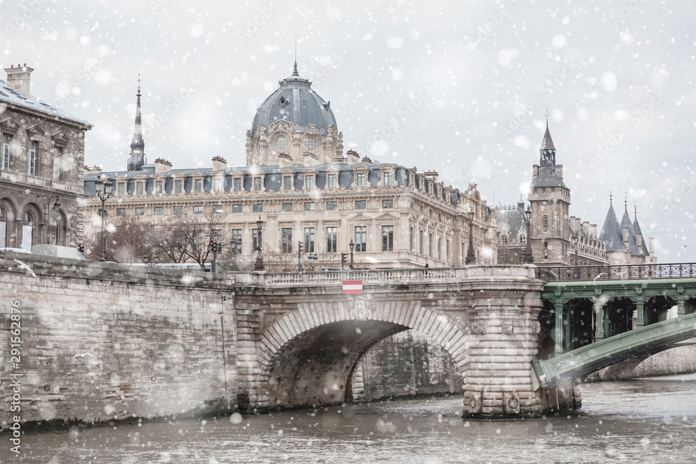 Paris cityscape with river and snow