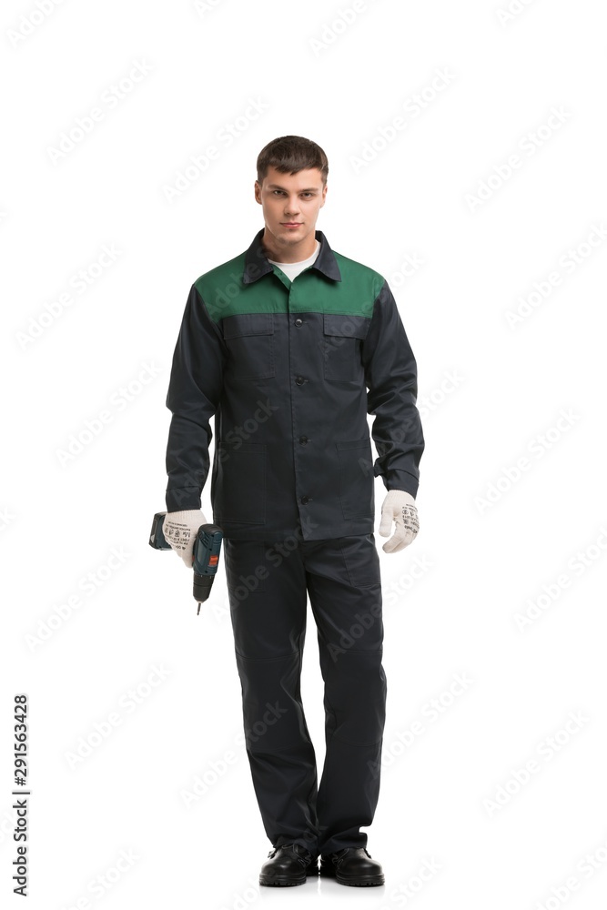 Man in working clothes with drill isolated shot Man in working clothes with drill isolated shot