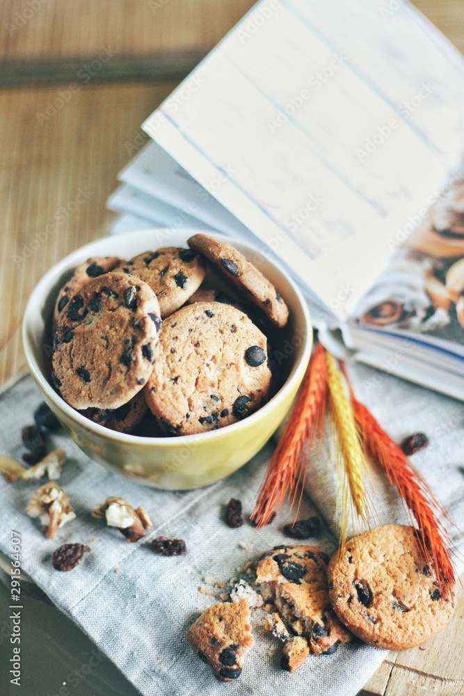Tasty cookies or biscuits at kitchen table, home comfort
