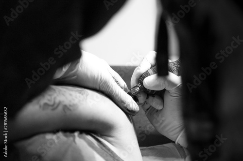 Black and white tattoo session.