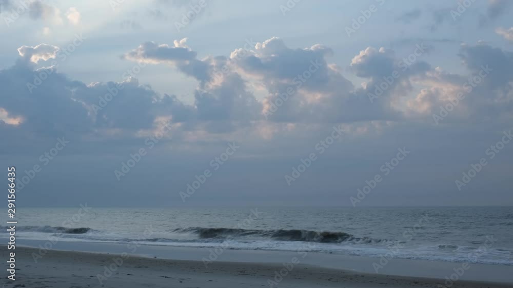 Beautiful sunrise and ocean side scenery at Topsail Beach, a vacation community by the Atlantic ocean in North Carolina, USA Beautiful sunrise and ocean side scenery at Topsail Beach, a vacation community by the Atlantic ocean in North Carolina, USA