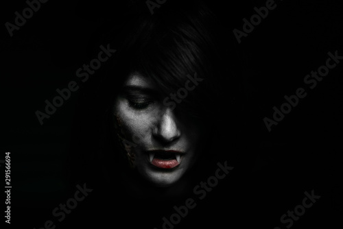 Fotografie Halloween Vampire Beautiful Woman over black