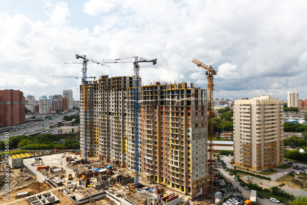 high-rise building under construction..construction site..construction of an apartment building. Tower cranes