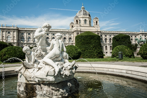 Ancient fountain made of white stone in front of Natural History Museum Vienna on the Maria Theresa Square