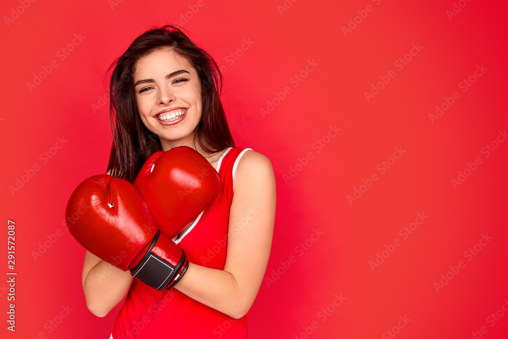 Happy fighter crossing arms in boxing gloves Happy fighter crossing arms in boxing gloves