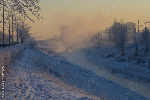 winter landscape with river and trees in winter © Anastasia