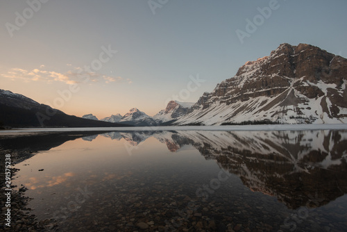 Bow lake at sunrise half frozen, Banff National park, Canada