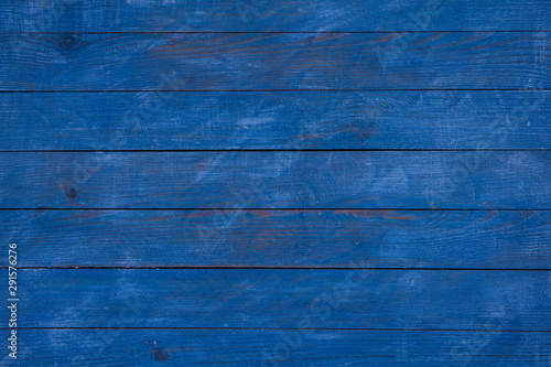 vintage blue wood background texture with knots and nail holes. Old painted wood. Blue abstract background.