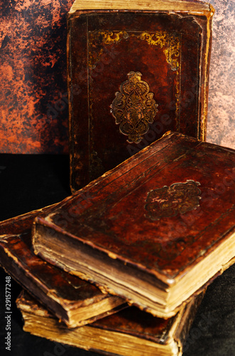 Obraz na płótnie A stack of old leather-bound Jewish books with gold stamping on black background w salonie
