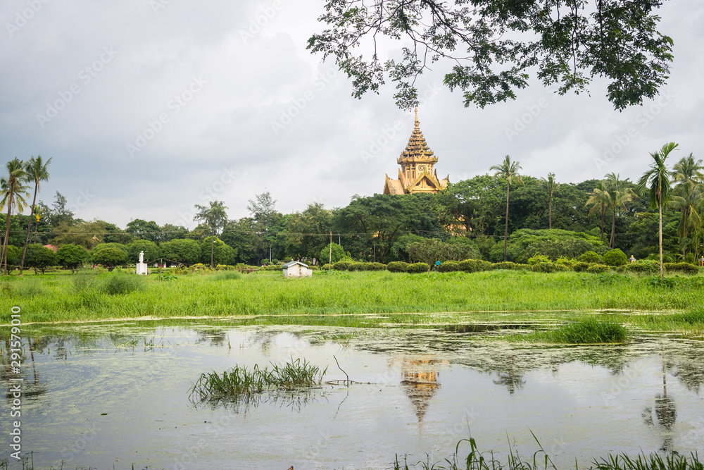 views of temple close to a lake in pegu city, myanmar views of temple close to a lake in pegu city, myanmar