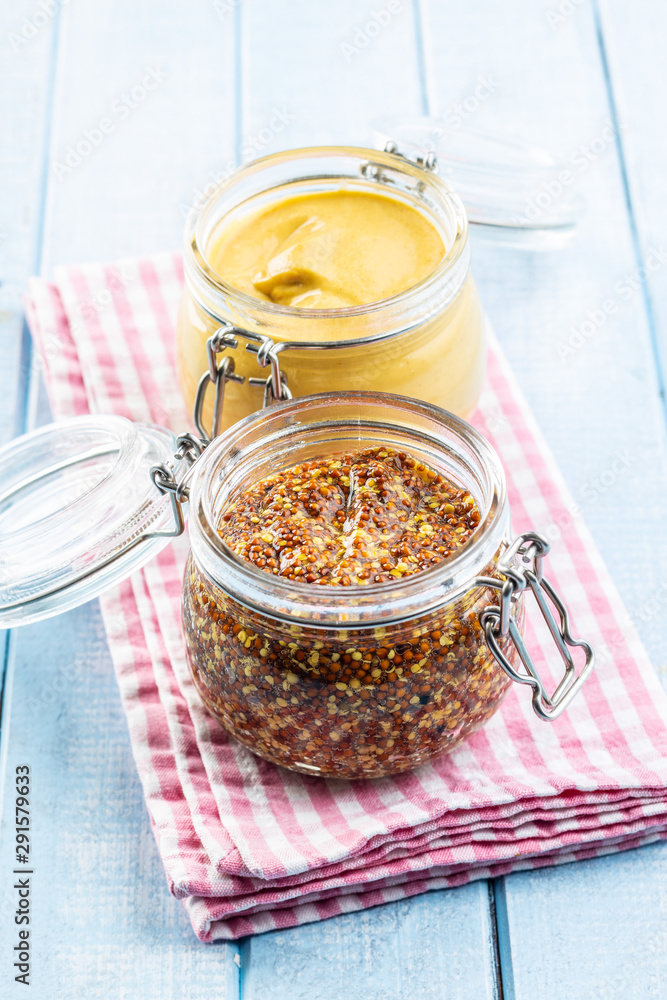 Fototapeta premium Yellow mustard and whole grain mustard.