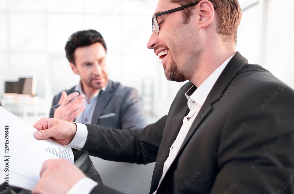 close up.businessman is analyzing financial report. close up.businessman is analyzing financial report.