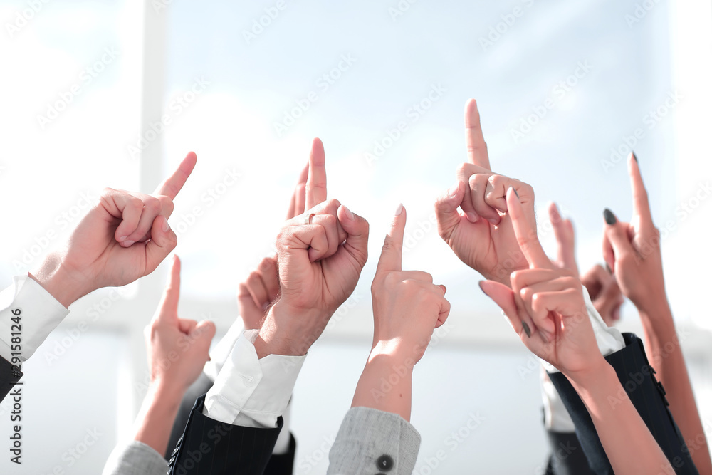 close up. a group of business people pointing up close up. a group of business people pointing up