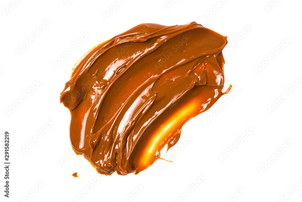 Melted tasty caramel splashes isolated on white background. Melted tasty caramel splashes isolated on white background.