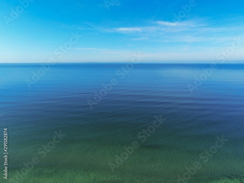 Beautiful bright and colorful water texture surface, Blue clean sky and water, West coast of Ireland, Atlantic ocean.