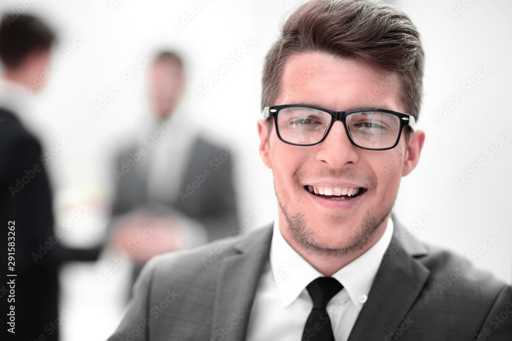 close up. the face of a young businessman in the office. close up. the face of a young businessman in the office.