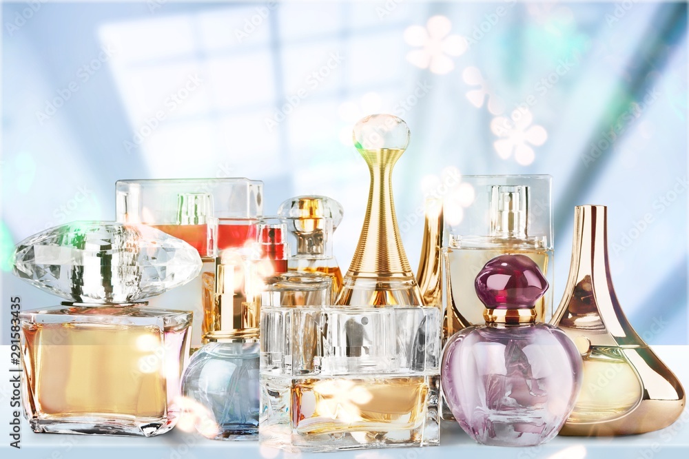 Fototapeta premium Aromatic Perfume bottles on background