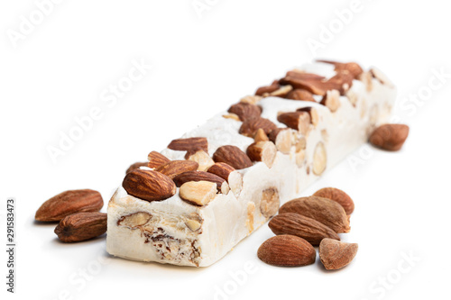 Homemade nougat bar with almonds isolated on white