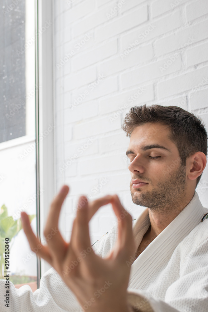 man practicing yoga with meditation position man practicing yoga with meditation position