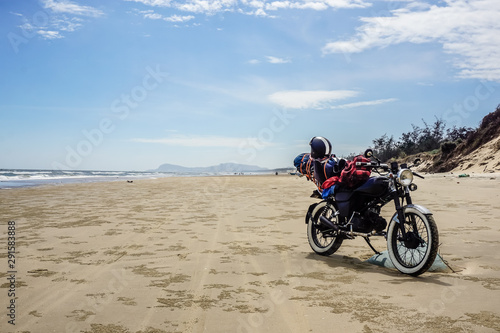 Motorcycle tour of Vietnam. Motorcycle on a wild beach in Vung Tau