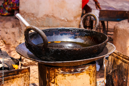 Billede på lærred extremely used and dirty frying pan, Indian street food, rajasthan, India