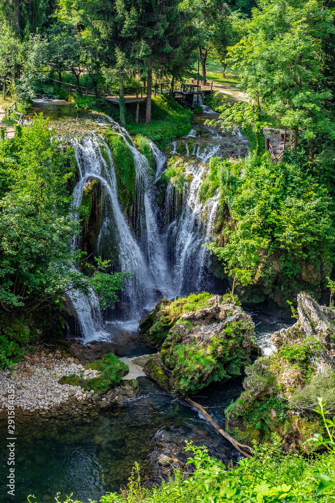 Obraz premium Waterfalls of Korana river in Rastoke village, near Slunj, Croatia, beautiful landscape with green trees on sunny summer day