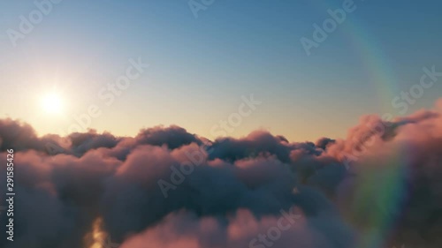 Beautiful realistic flight over cumulus lush clouds at sunset photo