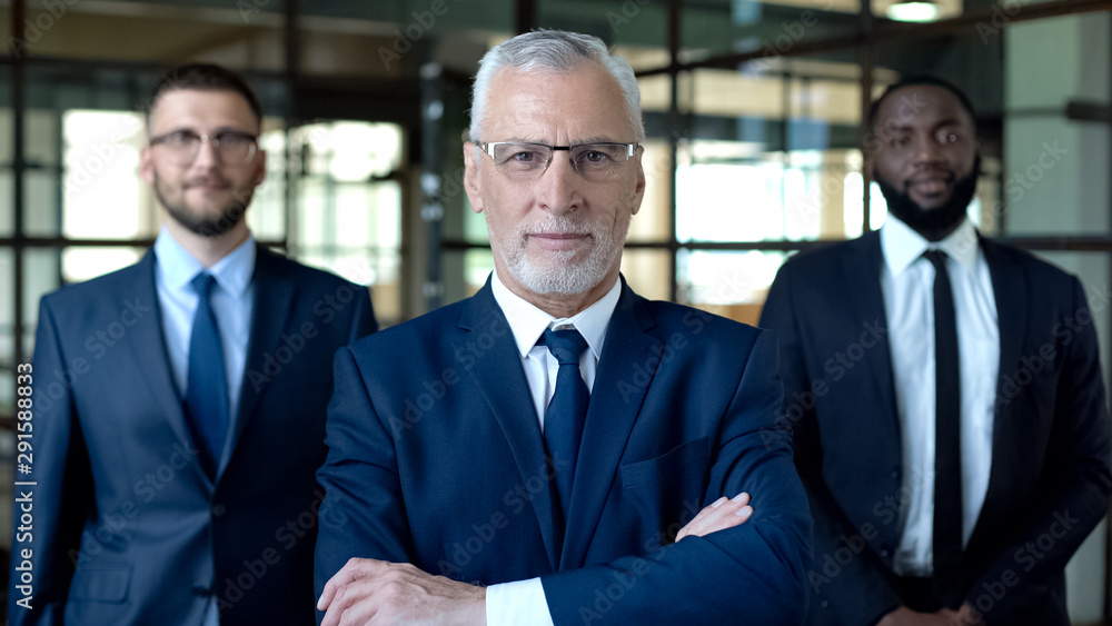 Successful businessmen looking camera, business consulting services, teamwork Successful businessmen looking camera, business consulting services, teamwork