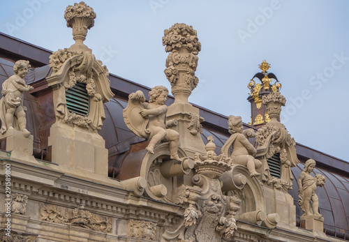 Zwinger, a palace in German city of Dresden, built in Baroque style. Sculptures on the roof. Architecture sightseeing in Germany. World historical heritage