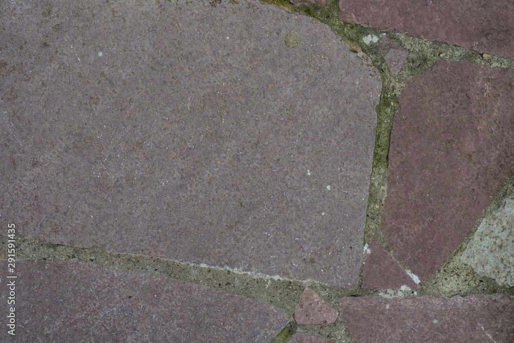 Fototapeta Background of stone-paved uneven track. Construction. Pieces of stone. Handwork.