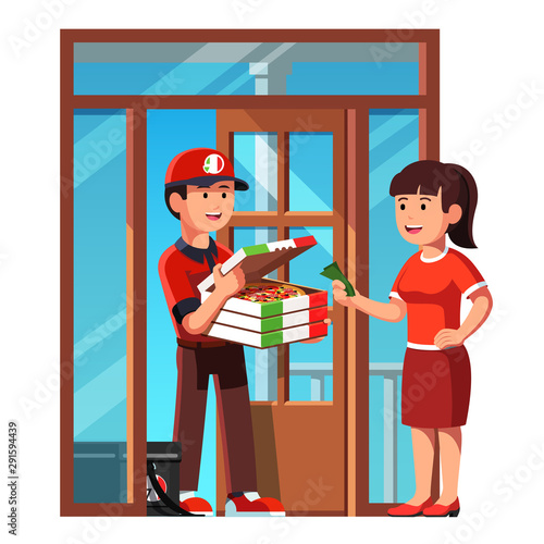Courier boy handing takeaway pizza in box at home